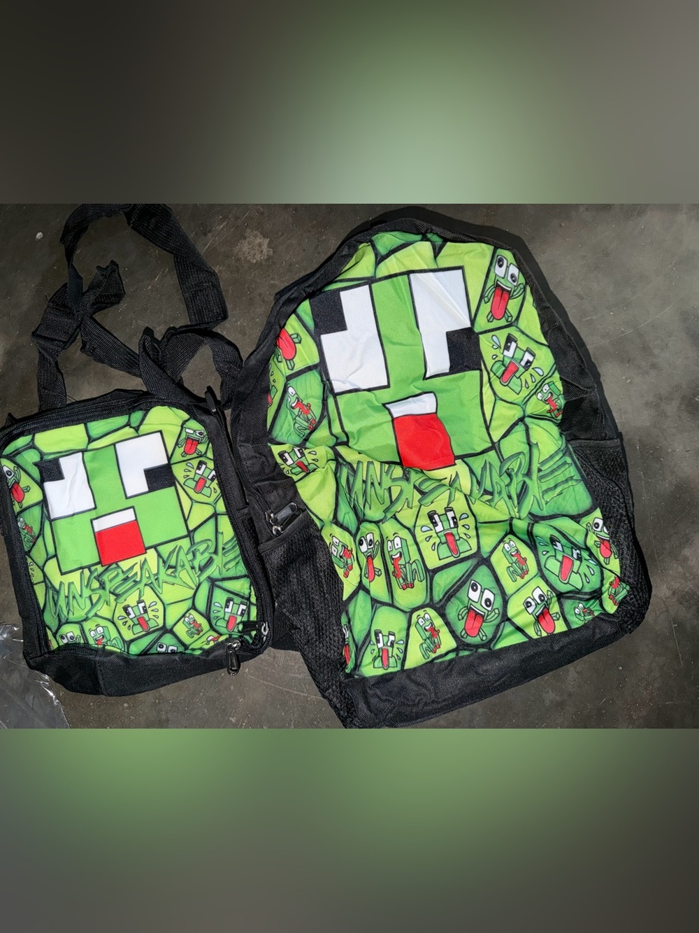 Green Pixel Face Backpack with Red Tongue Print and lunch box